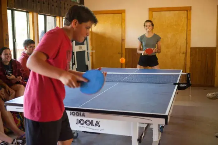 Campers playing ping pong