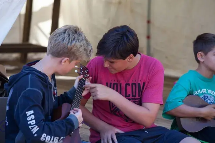 Boys playing guitar