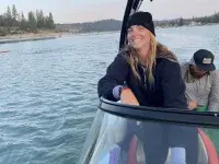 Ally Thoits on a boat on Bass Lake