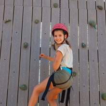 Camper on climbing wall